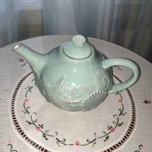 Seashore motif tea pot, seafoam in color.